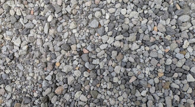 Top view of crushed stone and grey gravel texture background for construction or garden path