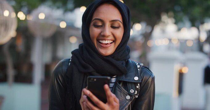 Phone, scroll and Muslim woman in city with laugh, social media joke and funny text message at night. Evening, bokeh and happy Islamic person in urban town with tech, internet humor and online meme.