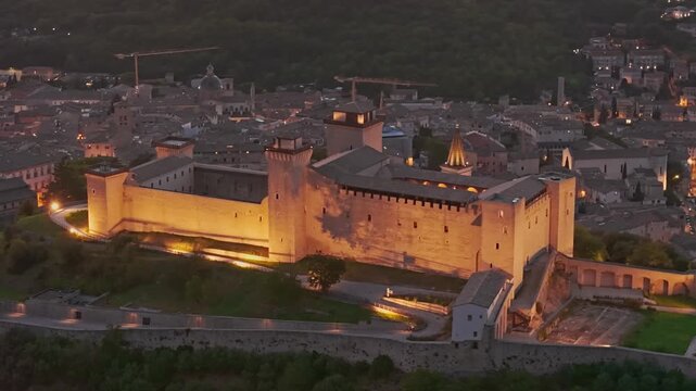 Aerial view of Spoleto at night with Ponte delle Torri and Fortress