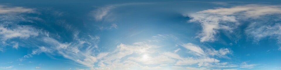 Obraz premium Sky panorama sun showing a wide view of white wispy clouds against a clear blue background for 3d environments