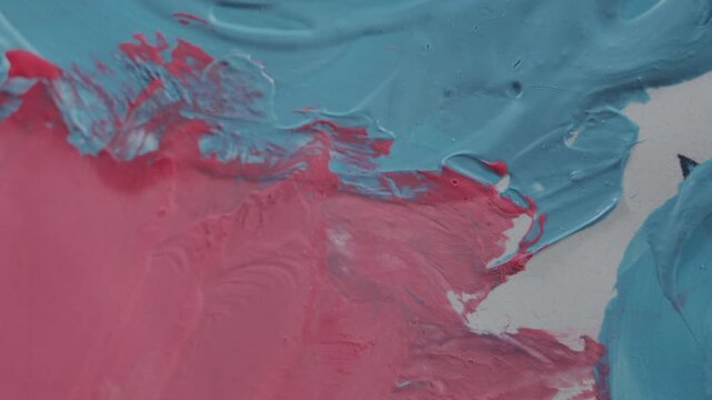 Beautifully lit abstract footage of paint smears. The changing light creates a mesmerizing