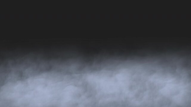 Ground fog rolling across a pitch black background, thick low lying mist for cinematic visual overlays