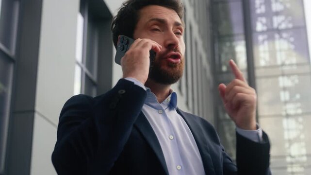 Angry Caucasian business man yelling smartphone conflict call outside city office stressed male businessman manager quarrel problem European guy screaming arguing discuss bad news chat outdoors urban