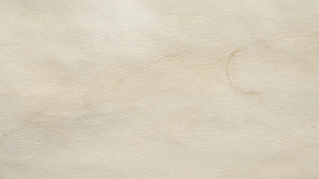 Old vintage paper texture background with aged stains and antique yellowed parchment effect