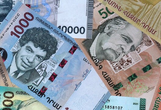 Armenian dram money banknotes bunch on table. Armenia bills of AMD currency close up
