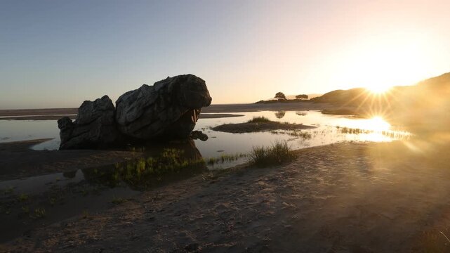 lagoon, Klein mountains, Grotto Beach, Hermanus, South Africa at sunset
