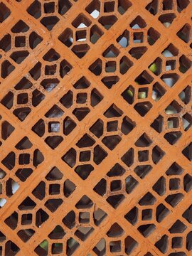 Terracotta vent block wall with decorative geometric lattice pattern