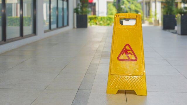 Warning signs. Seal the yellow plastic sign with caution for wet floor