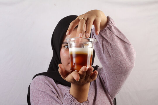 young woman with glass of bubur biji salak