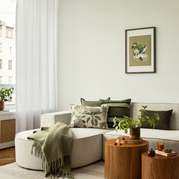 Minimalist Living Room Interior with Neutral Tones and Green Accents, Cozy Sofa, and Organic Decor Elements