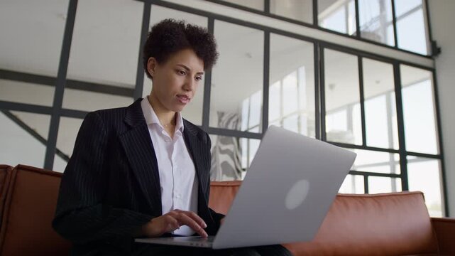 Entrepreneur Browsing Online On Laptop
