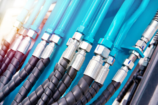 Hydraulic hoses and connectors on industrial machinery