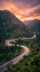 Fototapeta premium Scenic Mountain Road Through Green Valley Landscape