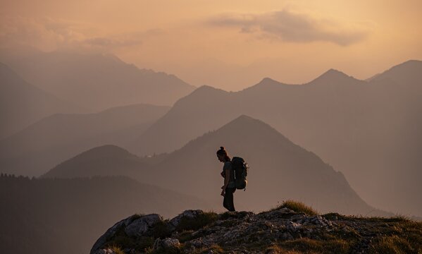 Evening mood, mountain silhouettes, hikers in front of hilly landscape, mountains and landscape, Bavarian foothills of the Alps, Benediktbeuern, Bavaria, Germany