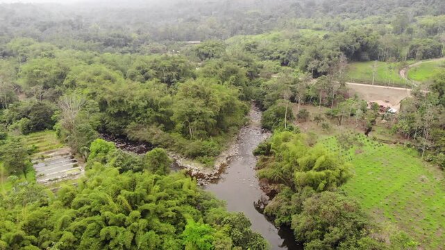 Aerial view of Rio Achiote, near Puerto Quito, Ecuador. Running through a largely human altered landscape which was formerly lowland rainforest in the biodiverse Choco Biogeographical Region