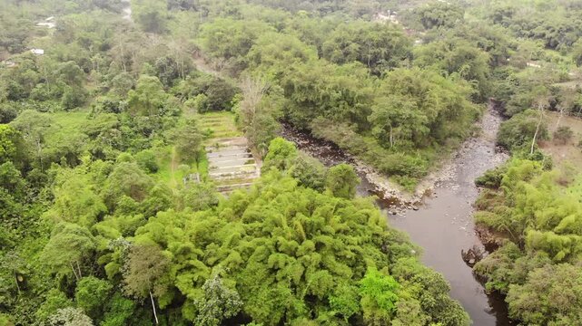 Aerial view of Rio Achiote, near Puerto Quito, Ecuador. Running through a largely human altered landscape which was formerly lowland rainforest in the biodiverse Choco Biogeographical Region