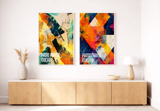 Two Vertical Picture Frame Mockups on White Wall Above Wooden Sideboard with Abstract Art