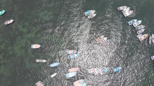 Aerial view of Paracas Bay with tourist boats and pier, Ica, Peru.