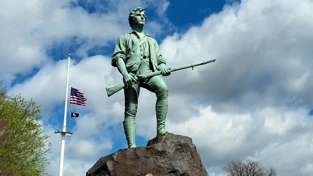 Amerca 250th Birthday, Minuteman Statue and the US flag in Lexington, MA on May 7, 2026