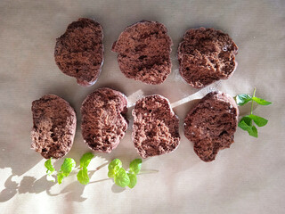 Chocolate cakes and green mint leaves herb baking cooking sweetness © siniy