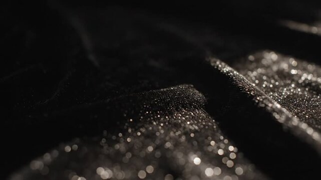 Macro Close Up of Black Glitter Fabric Texture with Sparkling Lights and Cinematic Shadows