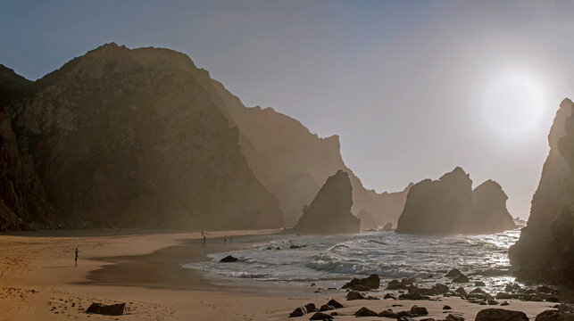 Praia da Ursa, Portugal: Beach with cliffs and ocean waves at sunset