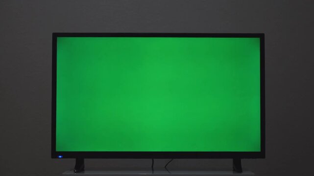 Modern TV with Green Screen on Bedside Table, Close Up Mockup
