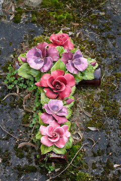 Floral cross memorial at P&egrave;re Lachaise Cemetery in Paris