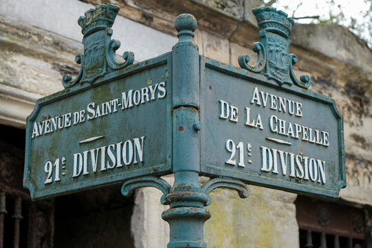 Vintage Paris street signs on blue metal post