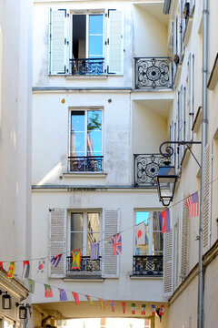 Paris apartment passage - courtyard with flags