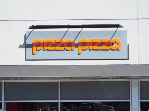 Gatineau, Quebec, Canada &ndash; April 18, 2026: The "Money Mart" storefront features a gray sign with French text Pr&ecirc;ts Instantan&eacute;s," "Insta Ch&egrave;ques and a red logo above glass doors and windows at 434A Bou