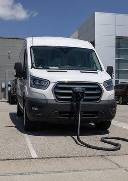 Used Ford E-Transit EV Cargo Van display. With pricing concerns, Ford is selling preowned vehicles to meet demand. MY:2022