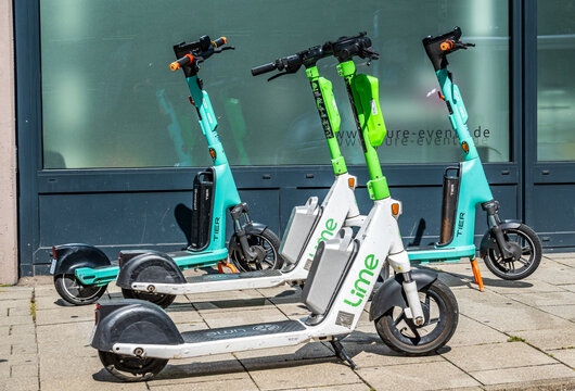 Munich, Germany - August 23: typical electro scooter at a sidewalk in munich on August 23, 2024