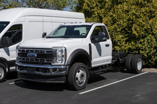 Ford F-550 Super Duty DRW Chassis Cab 4X4 display at a dealership. Ford offers the F550 with a 7.3L gas V8 engine. MY:2026
