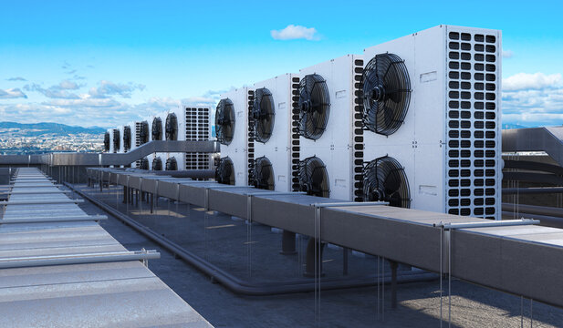 HVAC systems, Rooftop cooling. Outdoor air conditioning units and ducts operate on a commercial building roof.