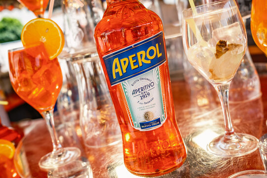 Munich, Germany - June 6: typical aperol bottle and glasses at a bar in Munich on June 6, 2025