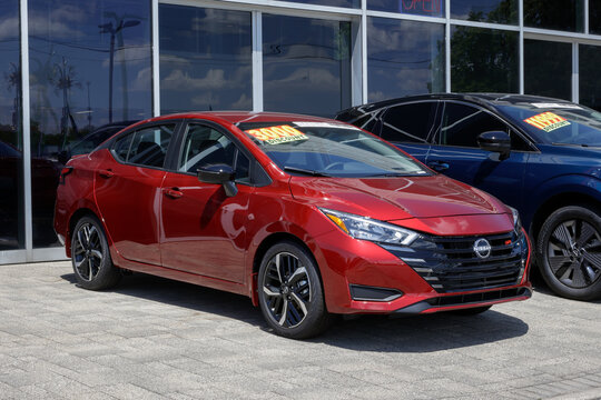 Nissan Versa SR Sedan display at a dealership. Nissan offers the Versa with a 1.6L 4-Cylinder engine. MY:2026