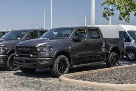 Ram 1500 Rebel Crew Cab 4X4 Truck display at a dealership. Ram offers the 1500 with a 5.7L HEMI V8 eTorque engine. MY:2026