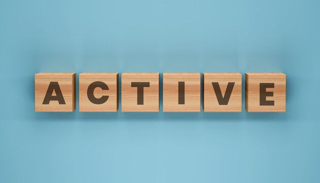 Active Wooden Cubes: Wooden cubes spell out the word ACTIVE against a plain backdrop, symbolizing energy, engagement, and motion.