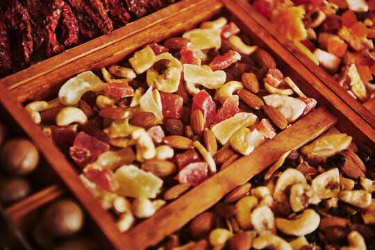 assortment of nuts and dried fruits packaged together, featuring visible ingredients like almonds, cashews, and various chewy red fruits