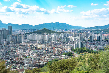 Fototapeta premium Seoul, South Korea - Mar. 08, 2026 : Panoramic cityscape of Seoul with dense residential buildings and Han River from Yongmasan observatory