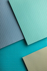 Fototapeta premium Teal leather texture fills the frame with detailed leather grain and clean leather surface. Natural background for mockup, copy space, branding, modern design, fashion color or 3 different leather
