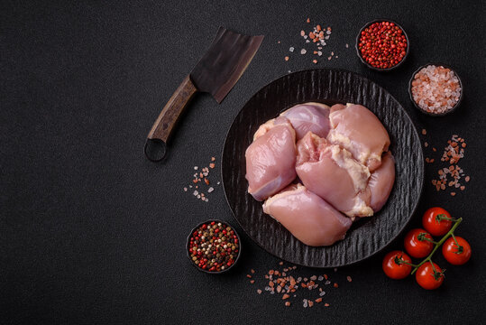 Raw chicken thigh fillet, boneless and skinless, for roasting. Raw thigh fillet