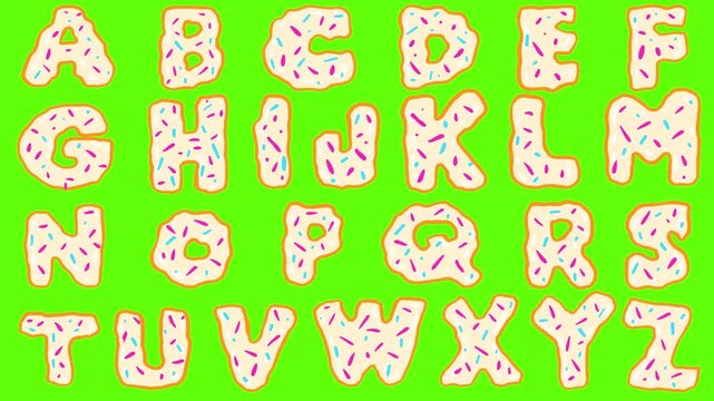 Dessert letters on a green background. English alphabet cookies with icing and sugar sprinkles in 2D style. Stock video with sweet letters.