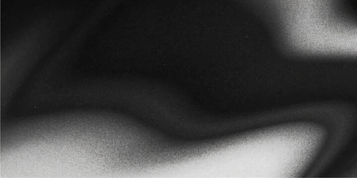 Sensual silhouette of a slim naked woman's bare back and torso against a black and white textured fabric background with dark light highlighting her figure and skin