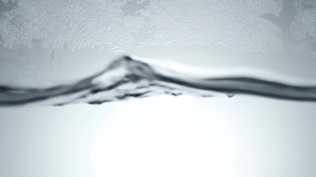 Close-up of a frosted glass surface divided by a thin metallic frame with a soft blue gradient below