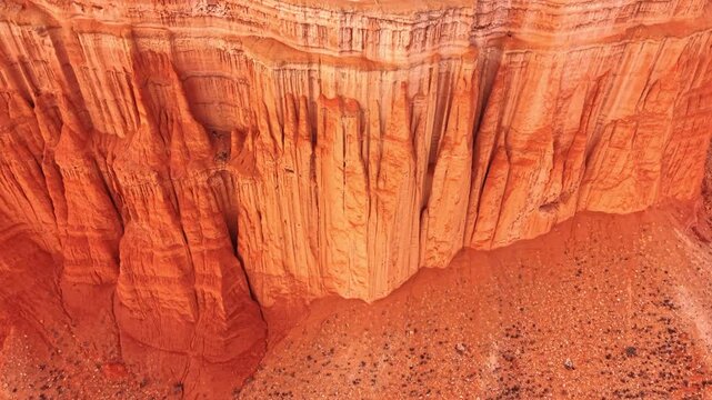 Jaw-dropping cliffs and spires of sandstone. Drone flight along the red canyons of Mesozoic-era in Teruel, Spain.