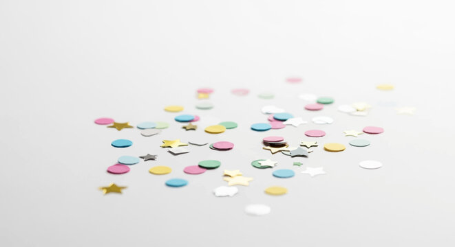 Colorful confetti scattered on surface.