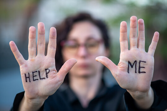 Hands with 'HELP ME' Written on Palms &mdash; Distress Concept
