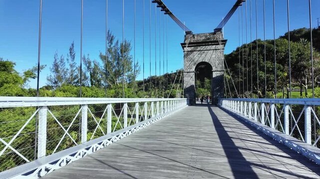 Scenic footage of the old suspension Bridge Pont Des Anglais in Saint Anne, Reunion, France	